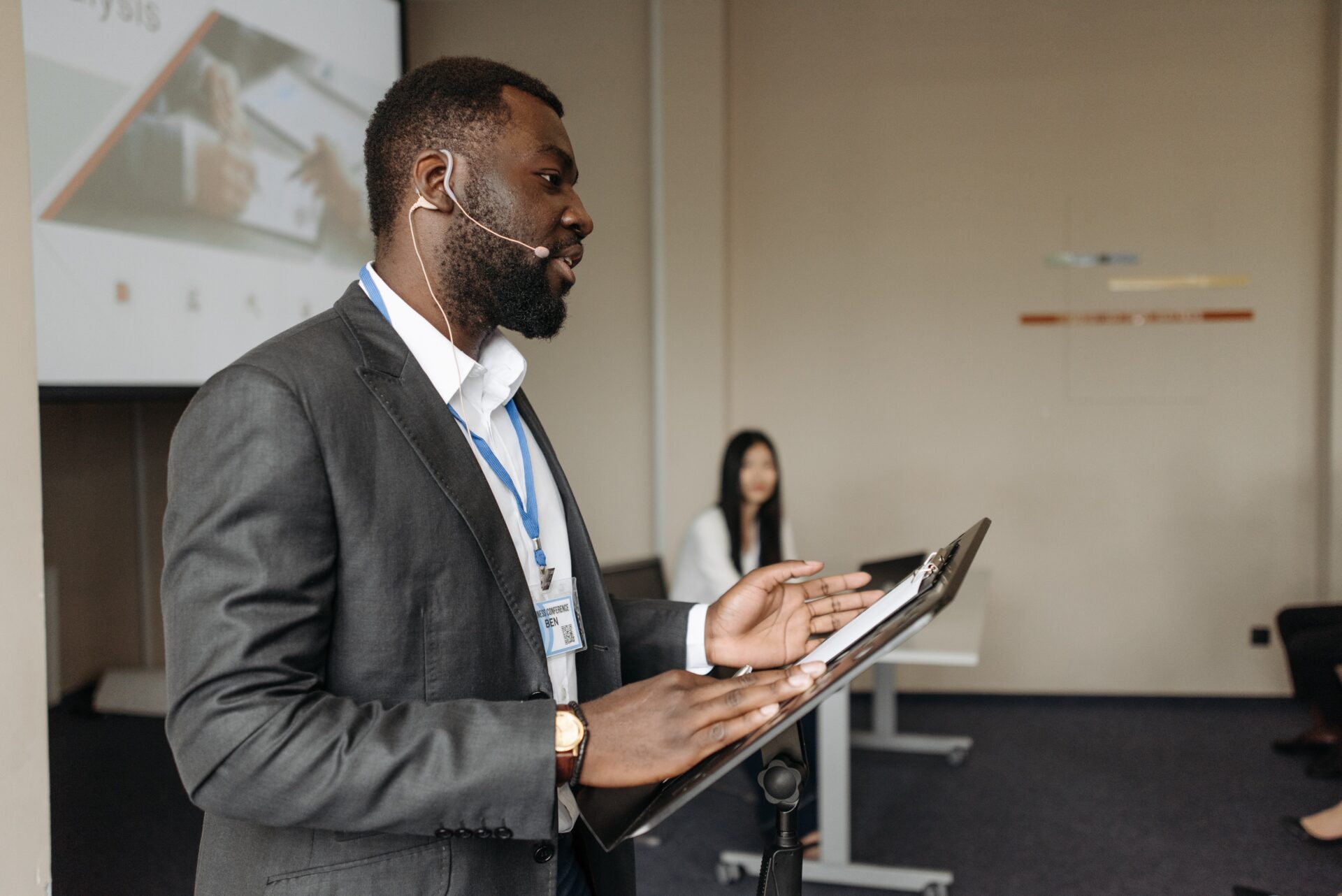 Black businessman giving presentation with flipchart.