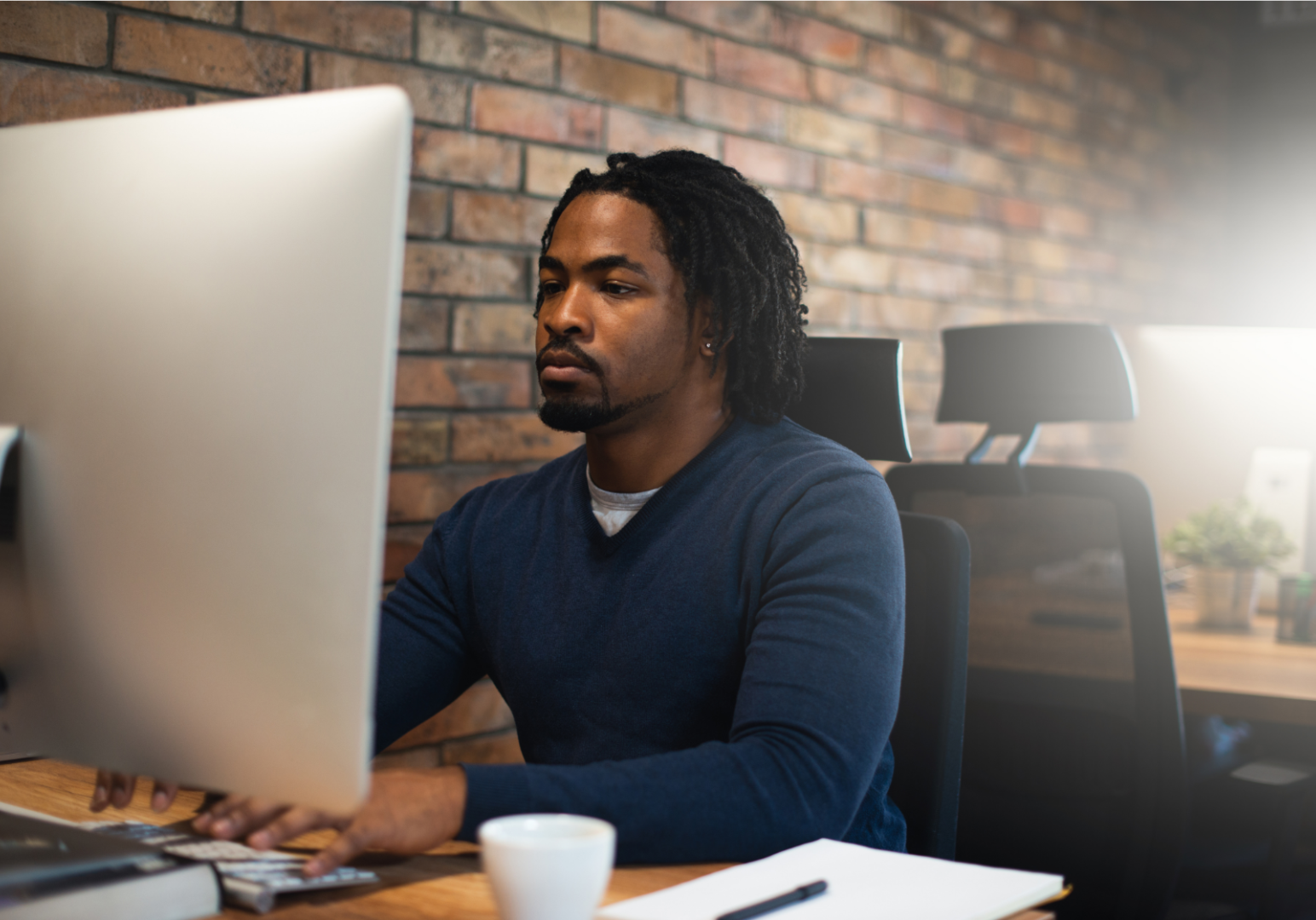 A man is working on his computer.