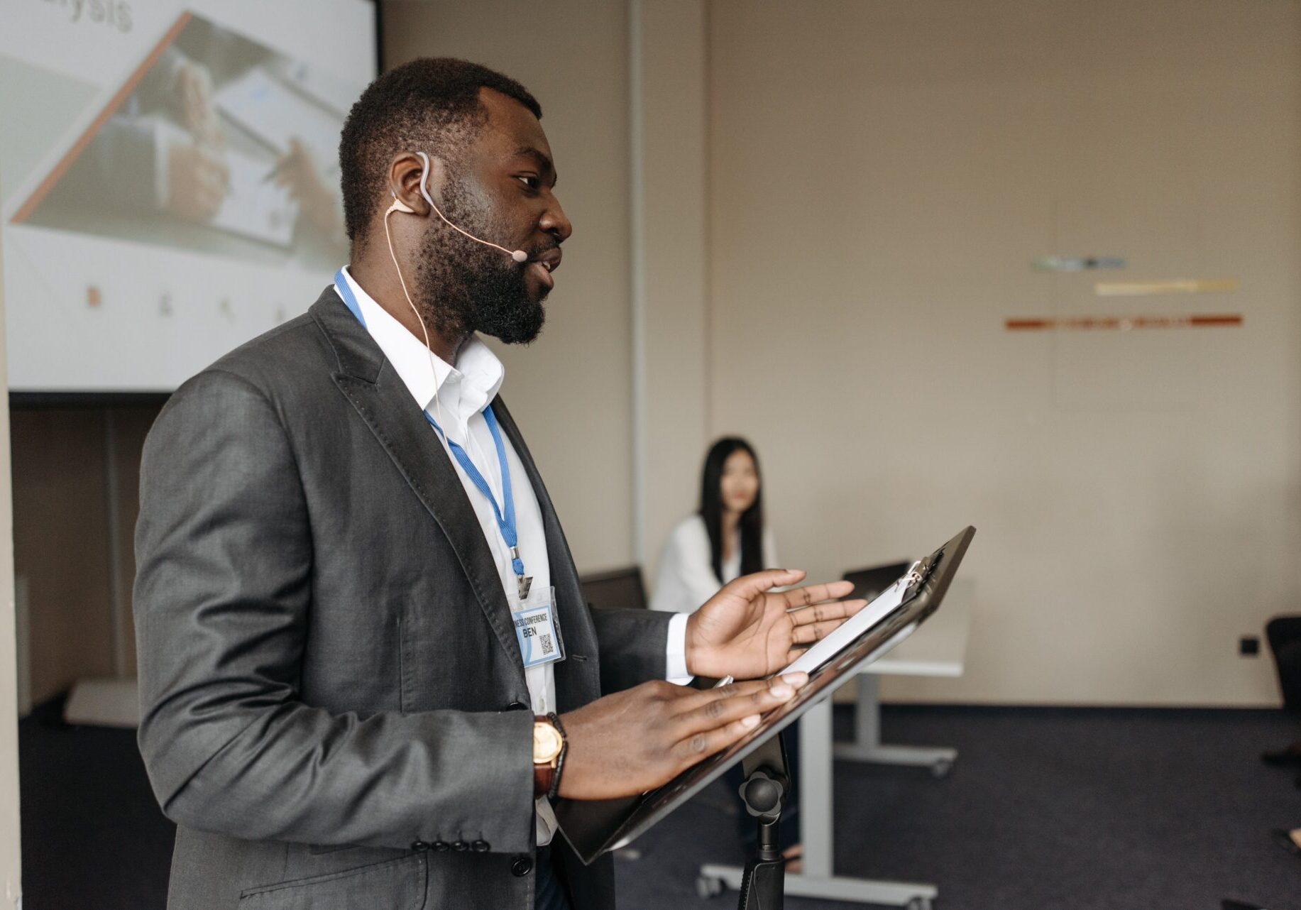 Black businessman giving presentation with flipchart.